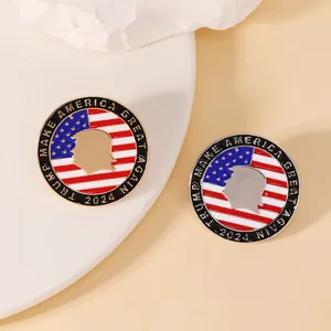 Detail of round Trump 2024 enamel pins with gold and silver metal edges for supporters