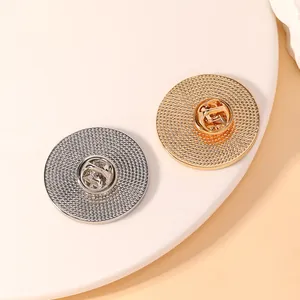 Gold and silver round textured metal badges with butterfly pin clasps for DIY jewelry