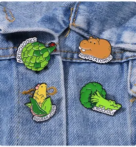 Creative enamel pins set featuring animal-vegetable mashups on denim jacket