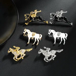 Detailed view of horse-themed enamel brooches with rhinestones on black texture