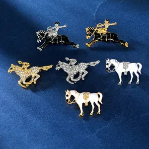 Macro view of detailed equestrian horse brooches with enamel finish and sparkling crystals