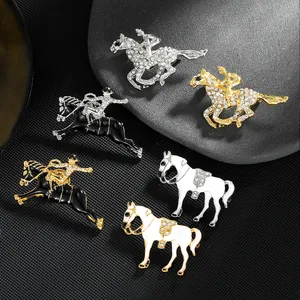 Detailed macro of equestrian brooches with enamel glaze and crystal inlay on stones
