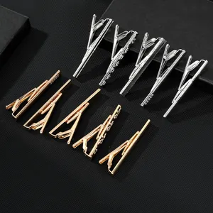 Classic silver and gold men's tie clips set with diverse metal textures and patterns