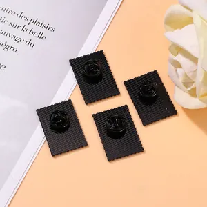 Black stamp-shaped enamel flower pins with butterfly clasp backing and anti-slip texture