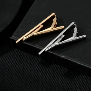 Classic silver and gold tie clips for men with a polished finish and secure clasp