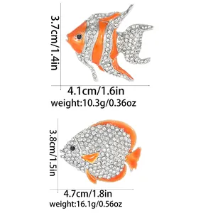 Sparkling crystal fish brooches in silver alloy with orange enamel and size details