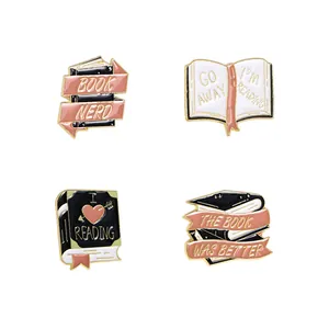 Set di 4 spille a libro in smalto nero rosa e oro per zaini e risvolti di giacche