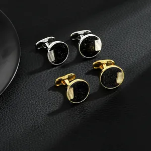 Détails de boutons de manchette ronds en onyx noir, finitions or et argent