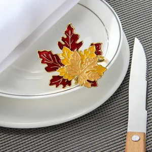 Golden maple leaf napkin ring with vibrant fall colors for elegant holiday table decor