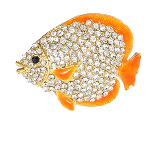 Golden fish brooch with white rhinestones and orange enamel finish details