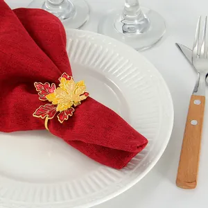 Detail of maple leaf napkin ring with red and yellow enamel for festive table decor
