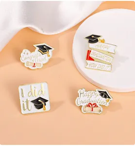 Detail of four graduation enamel pins with gold plating and congrats grad lettering