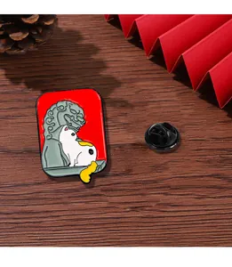 Detailed close-up of a white cat and stone lion enamel pin with traditional Chinese motifs