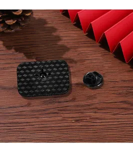 Detailed back view of a rectangular enamel pin with honeycomb texture and rubber clasp