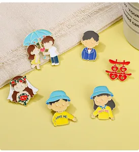 Detail of six wedding enamel pins with traditional Double Happiness and couple designs