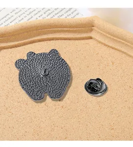 Detailed close-up of the metal enamel pin back with butterfly clasp and anti-slip texture