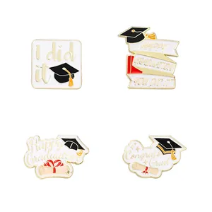 Set of four graduation enamel pins with black mortarboard and congrats letterings