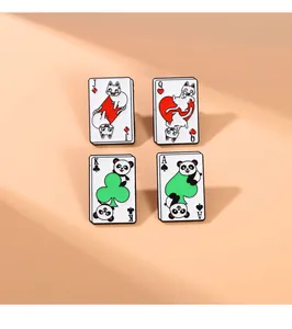 Detail of four enamel pins featuring cartoon cats and pandas on poker cards J Q K A