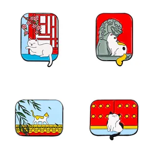 Set of four Chinese style enamel cat pins featuring traditional palace architecture scenes