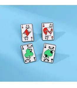 Detail of four cartoon cat and panda poker enamel pins on a light blue background