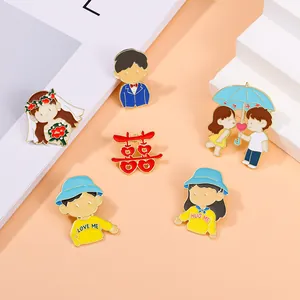 Set of cartoon enamel wedding brooches with double happiness symbol and bridal couple