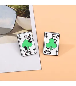 Detail shot of panda poker card enamel pins featuring Ace of Spades and King of Clubs