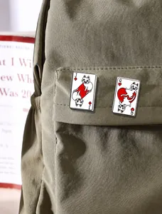Detailed enamel pins set featuring cartoon cats on playing cards J and Q designs