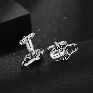 Detailed macro view of vintage silver beetle cufflinks with realistic textured finish