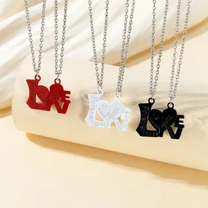 Close-up of interlocking alloy heart pendants with engraved Forever Love you text
