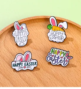 Detailed macro view of four colorful enamel Easter bunny and egg lapel pins on wood