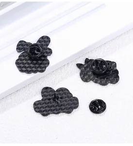 Detailed back view of enamel pin featuring honeycomb texture and black rubber clutch