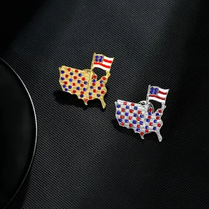 Detailed view of American map brooches with red and blue rhinestones in gold and silver finish