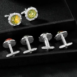 Classic silver round cufflinks with green stone and sparkling crystals on black leather