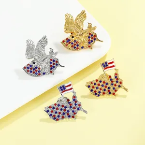 Detailed macro view of American eagle and flag brooches set with gold and silver finishes