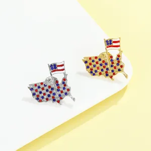 Detailed close-up of US map brooches with eagle elements and red blue rhinestones