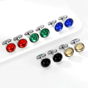 Macro shot of colorful round gemstone cufflinks set with polished silver metal finish