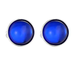 Minimalist round blue gemstone cufflinks with polished silver metal frame for men
