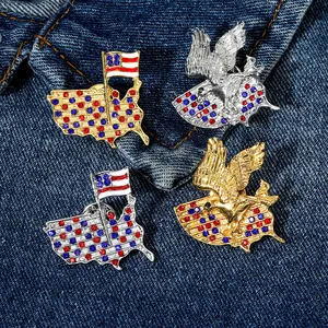 Vintage eagle and US flag brooches with crystals on denim background, set of four pieces