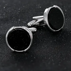 Boutons de manchette ronds pour hommes avec grès noir étoilé et bords en métal rainuré