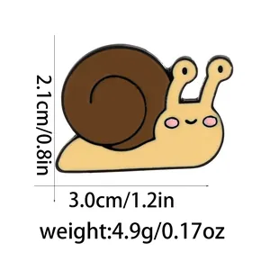 Detail showing cartoon snail enamel pin dimensions of 1.2 inches wide and 0.8 inches high