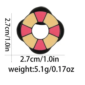 Detail view of pink and beige badge with 2.7cm size and 5.1g weight specifications