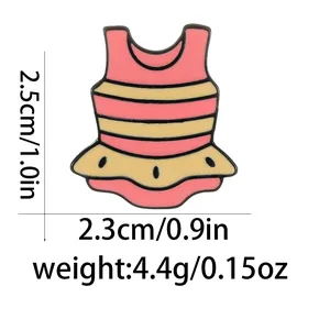Detailed view of pink striped dress enamel pin with dimensions 2.5cm height and 2.3cm width