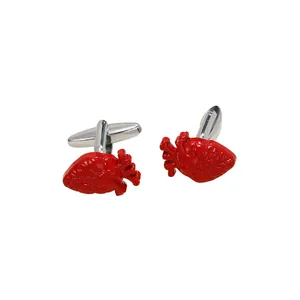 Artistic anatomical heart cufflinks in silver metal with realistic red organ textures