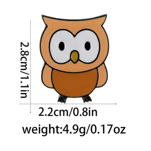 Detail view of cartoon owl enamel pin showing size dimensions of 2.8cm by 2.2cm