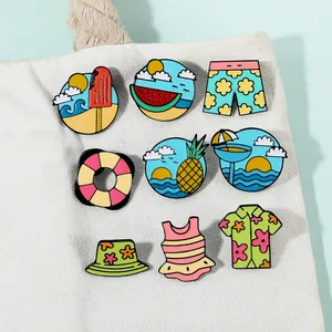Detail of 9 colorful summer beach enamel pins displayed on a white canvas backpack
