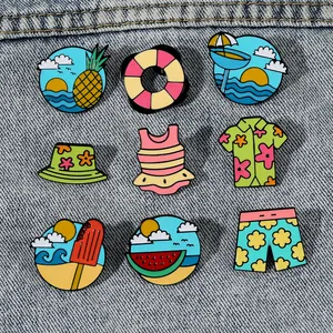 Set of 8 summer beach enamel pins featuring pineapple and swimwear on denim fabric
