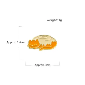 Cute sleeping orange cat enamel pin brooch with minimalist gold outline and 3cm length