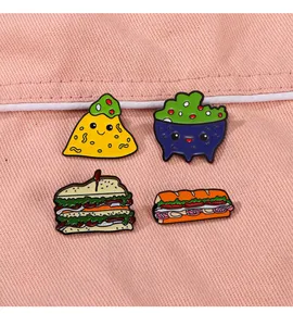 Detailed close-up of cute cartoon food enamel pins on pink fabric texture