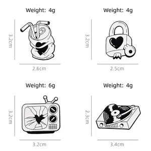 Set of four vintage black and white enamel pins featuring retro TV, record player, and locks