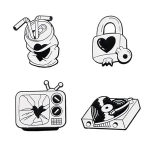 Set of 4 vintage black and white enamel pins with record player and TV designs